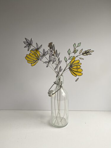 Glass and metal flowers in yellow by Samantha Yates