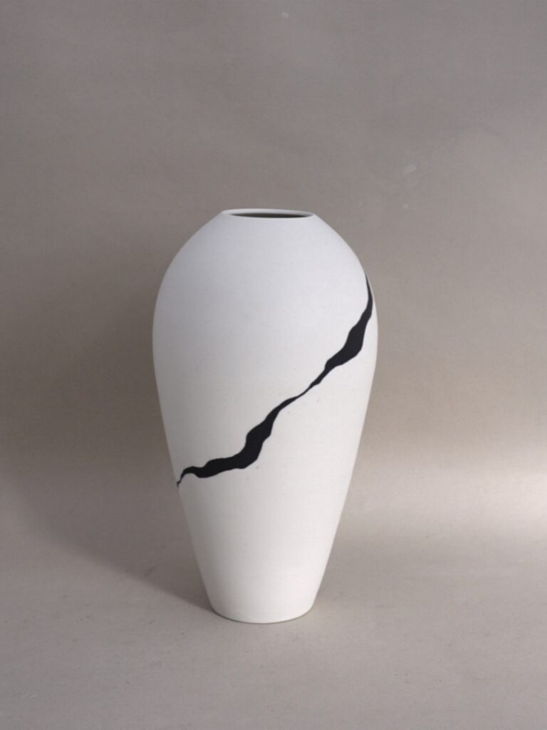 Tall porcelain jar, inlaid with black ribbon £120