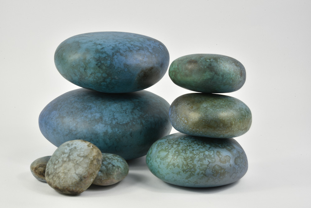 Janen Waudby. Smoke-fired ceramic pebbles (blue)