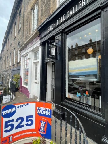 Gallery window showing Edinburgh Fringe festival venue 525 sign